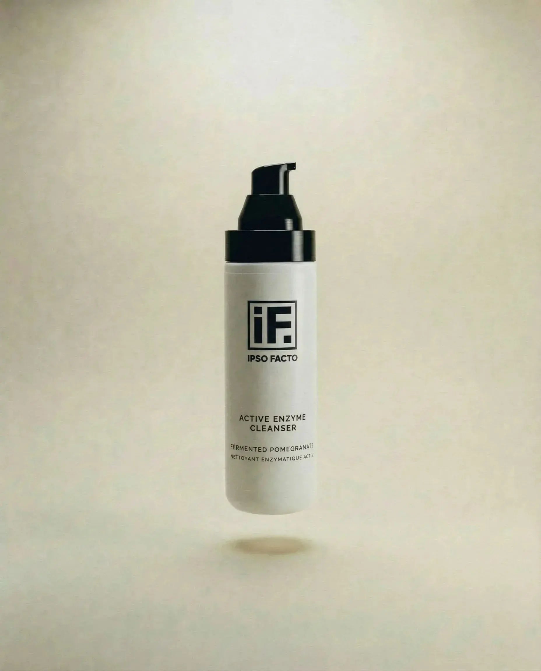 Active Enzyme Cleanser bottle with pump, floating on neutral background, skincare product