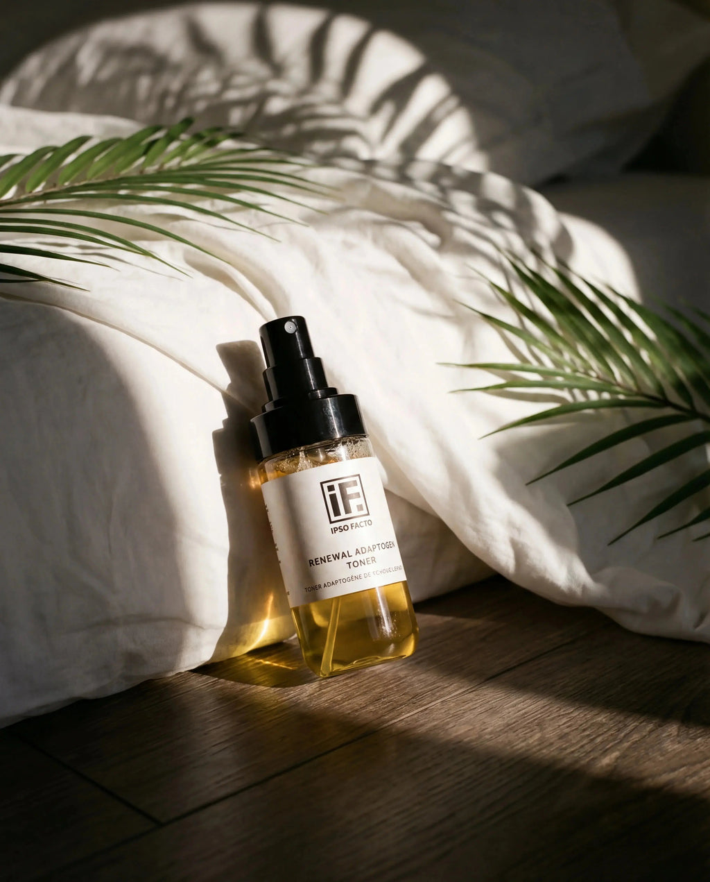 Natural skincare toner bottle on wooden floor, sunlight and palm leaves, clean beauty concept