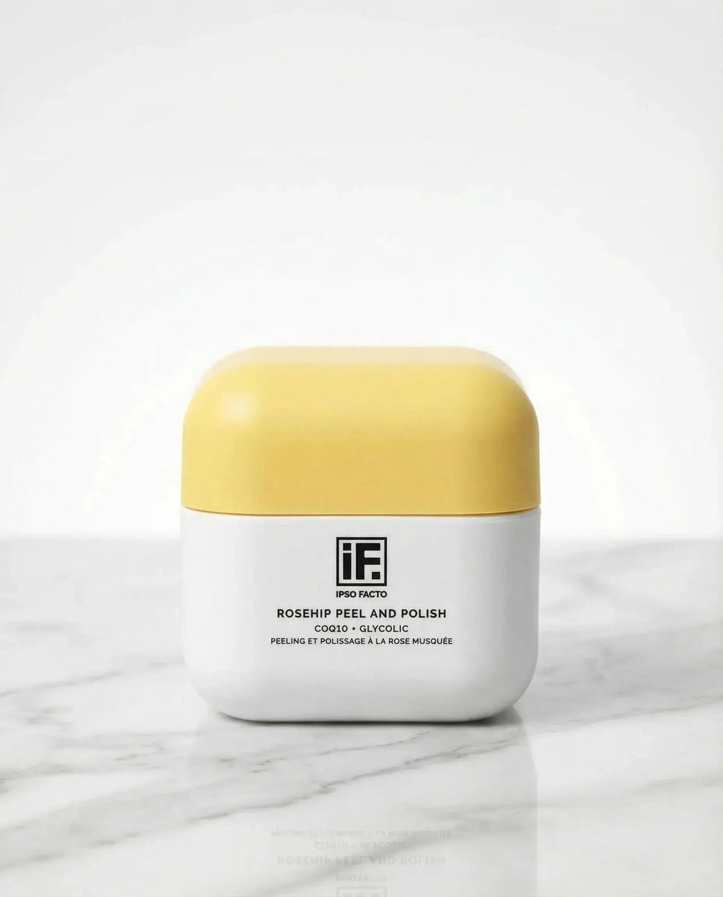 Rosehip Peel and Polish skincare jar with yellow lid on marble surface