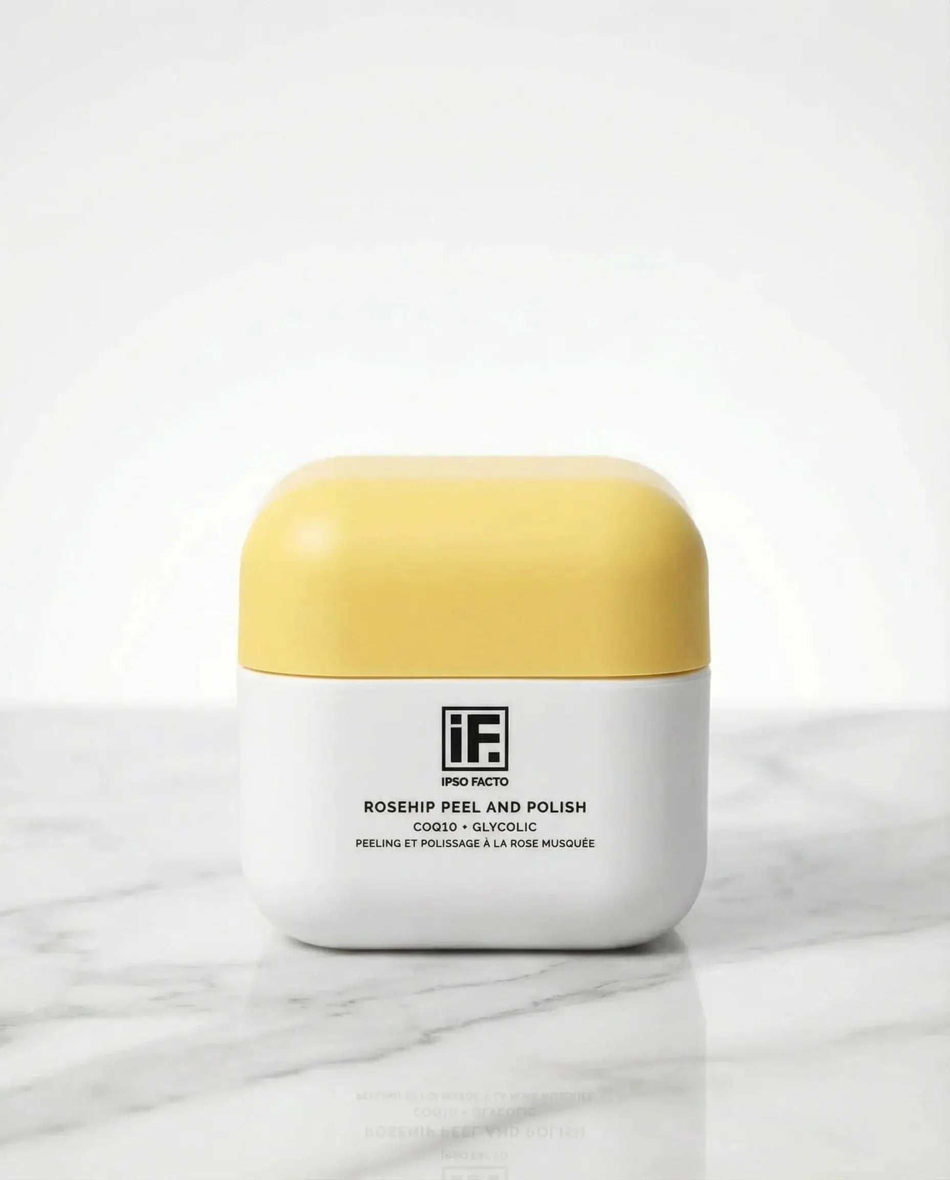 Rosehip Peel and Polish skincare jar with yellow lid on marble surface