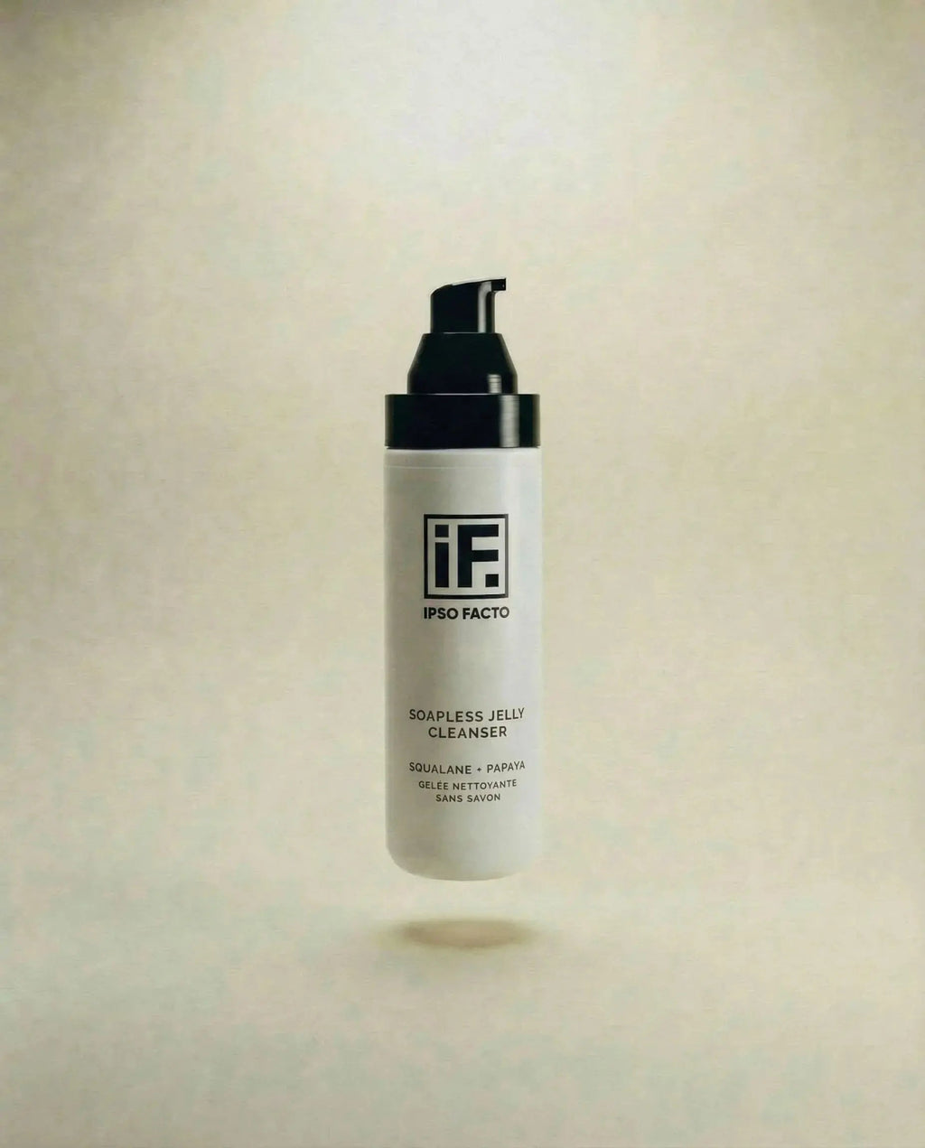 Soapless jelly cleanser bottle with pump, squalane and papaya formula on neutral background