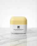 Triple Action Resurfacing Peel skincare jar with yellow lid on marble surface