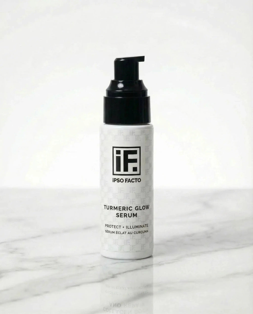 Turmeric Glow Serum skincare bottle with pump on white marble background